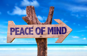 Peace of Mind directional sign with beach background